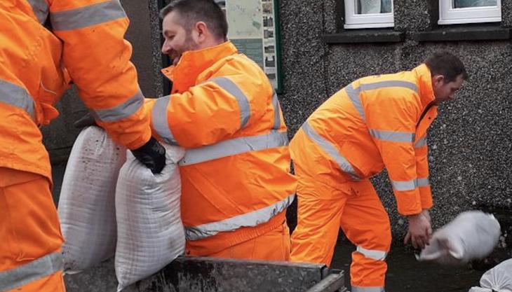 Shap Beck Quarry staff delivering sand bags Shap Quarry staff