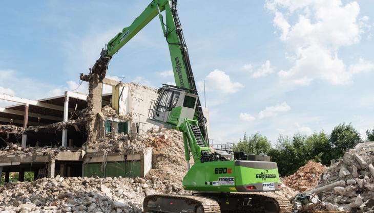 Metz GmbH use Sennebogen 830 R-HDD E material handler to demolish eyesore derelict building Sennebogen materials handler