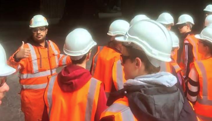 Tarmac graduate engineer Hassan Munir showing students the kiln at Dunbar cement plant Visitors to Dunbar cement plant