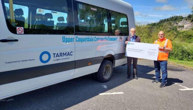 Harden quarry manager Gareth Williams presenting the cheque to John Lazarus, chair of the trustees at UCCT Upper Coquetdale Community Transport