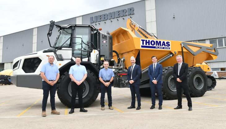 Official handover of Thomas Plant Hire’s first TA 230 dumptruck. L-R: Daniel Sullivan, Gwyn Thomas and Wyn Thomas of Thomas Plant Hire; and Lee Palmer, Richard Gee and Michael Atkinson of Liebherr GB Liebherr TA 230 dumptruck for Thomas Plant Hire