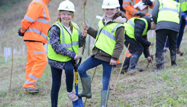 Pupils from Kneesall Primary School helping with tree planting at Forterra's Jubilee Wood Tree planting