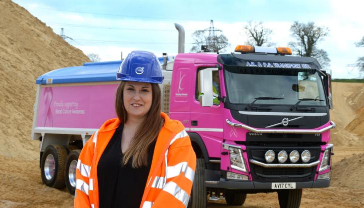 April Forder with Breast-Cancer Awareness liveried Volvo tipper truck April Forder with Volvo tipper truck