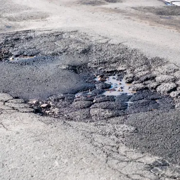 Councils in England will need to prove their progress on the pothole plague or face losing cash