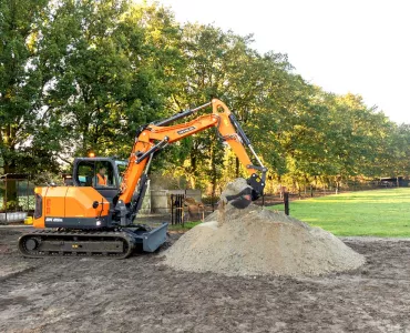 Develon DX85R-7 compact excavator in operation 