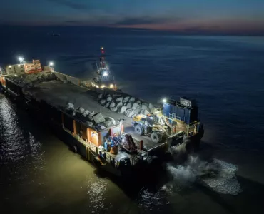 Aggregate Industries’ SeaRock barge carrying the armour-stone on the final leg of the journey to Blue Anchor Beach