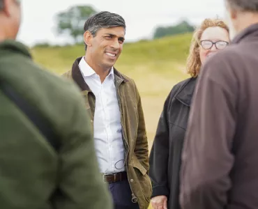 Rishi Sunak talking to staff and volunteers at Thornborough Henges in North Yorkshire. Photo: The Conservative Party