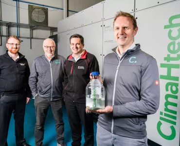 L–R: Dr Andy Harris, advanced engineering manager at Wrightbus; Prof. Roy Douglas, chief technology officer and co-founder of Catagen; David Trimble, group engineering director at Terex Materials Processing; and Dr Andrew Woods, chief executive officer and co-founder of Catagen – pictured in front of Catagen’s ClimaHtech E-Fuel GEN Reactor