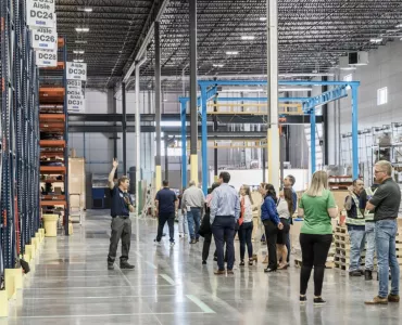 Grand opening attendees tour the new distribution centre