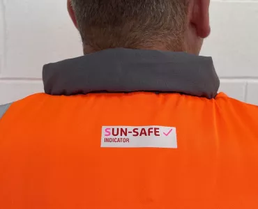 Sun-Safe Indicator applied to a new orange hi-vis garment