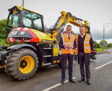 L-R: Transport Minister Mark Harper and JCB chief executive officer Graeme Macdonald with the JCB Pothole Pro