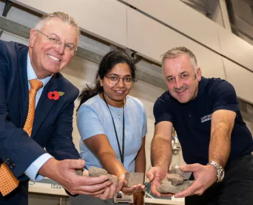 Scott Bros directors Bob Borthwick (left) and Peter Scott (right) with structural engineering lecturer Dr Thadshajini Suntharalingam with samples of the waste clay that make up the prototype bricks