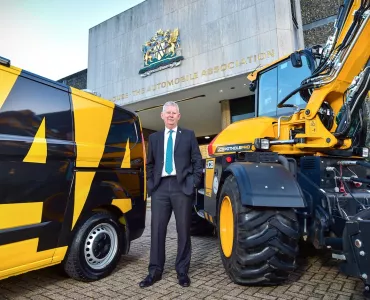 AA President Edmund King OBE pictured with an AA van and a JCB Pothole Pro outside the motoring association’s HQ in Basingstoke