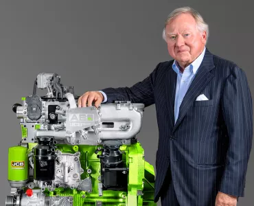 JCB chairman Anthony Bamford with one of the company’s hydrogen combustion engines