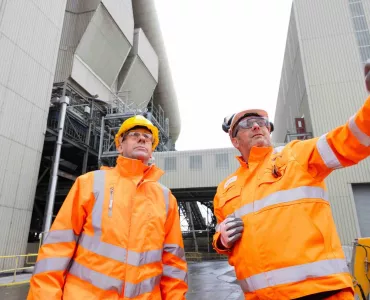 Lord Callanan, UK Minister for Energy Efficiency and Green Finance, being shown around Rugby cement works