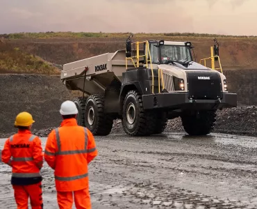 Articulated dumptrucks can move large amounts of material over challenging terrain in tough conditions