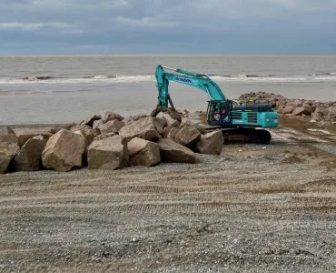 Rock armour is being strategically placed to create groynes at Rossall Beach
