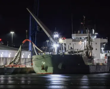 The cement carrier 'NACC Indian' discharging the first shipment of bulk cementitious product