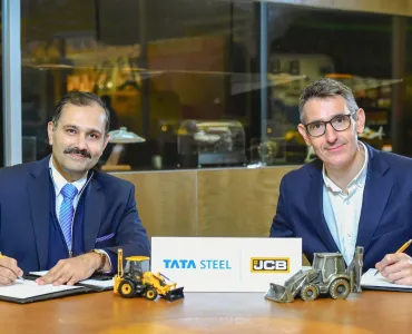 L-R: Anil Jhanji, chief commercial officer of Tata Steel UK, signing the MoU with Wayne Asprey, group purchasing director at JCB