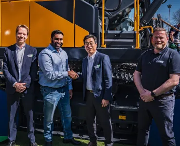 Rygor Group commercial director Rish Channa (centre left) and Chase Shim, managing director of Hyundai Construction Equipment Europe (centre right), shake hands on the appointment of Rygor Plant at the Bauma fair in Munich, with Bart van Berkel, network excellence development (left) and Anthony Hogben, regional sales manager (right)