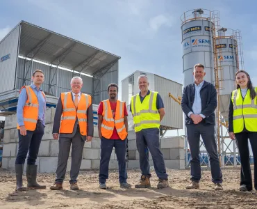 L–R: Prof. David Hughes; Bob Borthwick; Scott Bros recycling innovation engineer Feysal Shifa; Peter Scott; Joss Newberry; and Cassidy Smith, Teesside University’s IP and commercialization manager, at the low-carbon concrete plant