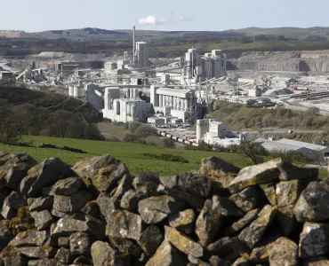 Carbon dioxide emissions generated by the UK concrete and cement sector are now 63% lower than 1990 levels