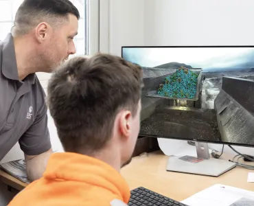 Fragmentation camera analysis of blasted material at a primary crusher tipping point