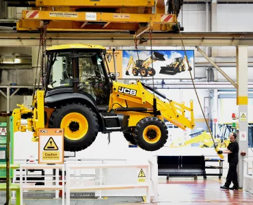 A JCB backhoe comes off the production line 