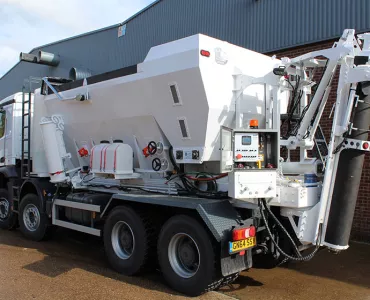 A volumetric concrete mixer truck