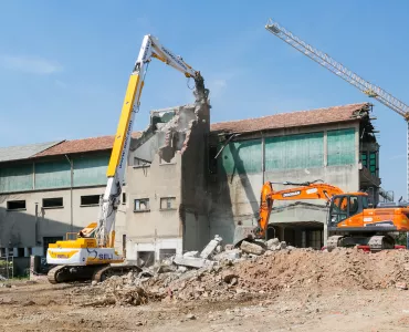 Doosan DX530DM demolition excavator and DX235LCR-7 working in tandem 