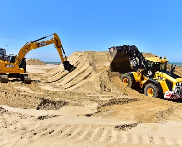 JCB machines on the beach