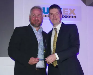 Philip Trimble (left) receives MHEA Innovation Award
