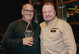 eff Udelson, managing principle of Easton Sales & Rentals, received Rokbak’s North American Dealer of the Year award from the company’s managing director, Paul Douglas