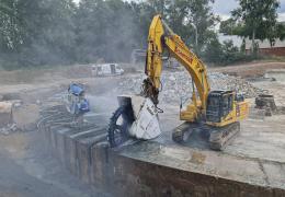 Schnittger cutting through the huge, ring-shaped rim of the basin with an excavator-mounted Kemroc DMW 220 cutter wheel