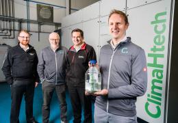L–R: Dr Andy Harris, advanced engineering manager at Wrightbus; Prof. Roy Douglas, chief technology officer and co-founder of Catagen; David Trimble, group engineering director at Terex Materials Processing; and Dr Andrew Woods, chief executive officer and co-founder of Catagen – pictured in front of Catagen’s ClimaHtech E-Fuel GEN Reactor