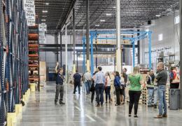 Grand opening attendees tour the new distribution centre