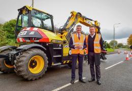 L-R: Transport Minister Mark Harper and JCB chief executive officer Graeme Macdonald with the JCB Pothole Pro