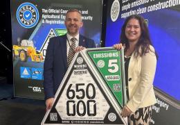 L-R: Steven Mulholland, chief executive officer of the CPA (Construction Plant Hire Association), and Beth Abbott, marketing and communications manager with the CEA, celebrating CESAR’s 650,000th registration milestone