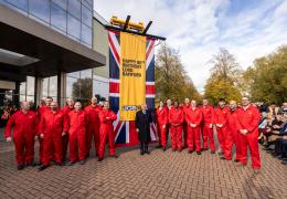 JCB’s demonstration team and Lord Bamford