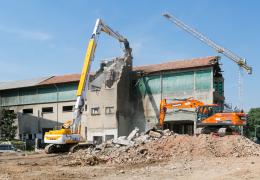 Doosan DX530DM demolition excavator and DX235LCR-7 working in tandem 