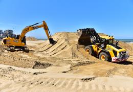 JCB machines on the beach