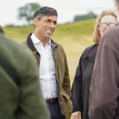 Rishi Sunak talking to staff and volunteers at Thornborough Henges in North Yorkshire. Photo: The Conservative Party