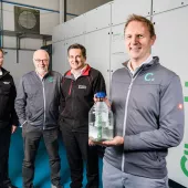 L–R: Dr Andy Harris, advanced engineering manager at Wrightbus; Prof. Roy Douglas, chief technology officer and co-founder of Catagen; David Trimble, group engineering director at Terex Materials Processing; and Dr Andrew Woods, chief executive officer and co-founder of Catagen – pictured in front of Catagen’s ClimaHtech E-Fuel GEN Reactor