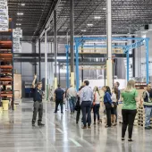 Grand opening attendees tour the new distribution centre