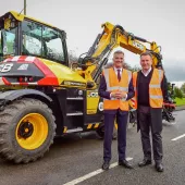 L-R: Transport Minister Mark Harper and JCB chief executive officer Graeme Macdonald with the JCB Pothole Pro