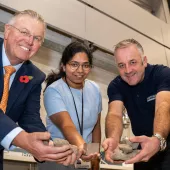 Scott Bros directors Bob Borthwick (left) and Peter Scott (right) with structural engineering lecturer Dr Thadshajini Suntharalingam with samples of the waste clay that make up the prototype bricks