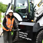 The Secretary of State for Energy Security and Net Zero, Claire Coutinho MP, tries her hand at the quick and easy task of refuelling a JCB backhoe loader with hydrogen