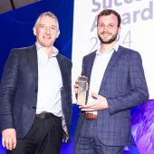 Sam Farnsworth (right) accepting the Customer Success Award for Excellence in Analytical Insights from Pete Wilkinson, managing director of Esri UK