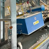 Bunting suspension electro magnet suspended over the conveyor