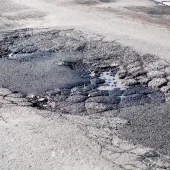 Councils in England will need to prove their progress on the pothole plague or face losing cash